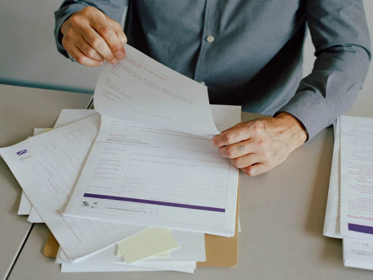 hero — a licensing specialist assembling a state medical license and NPPES application packet